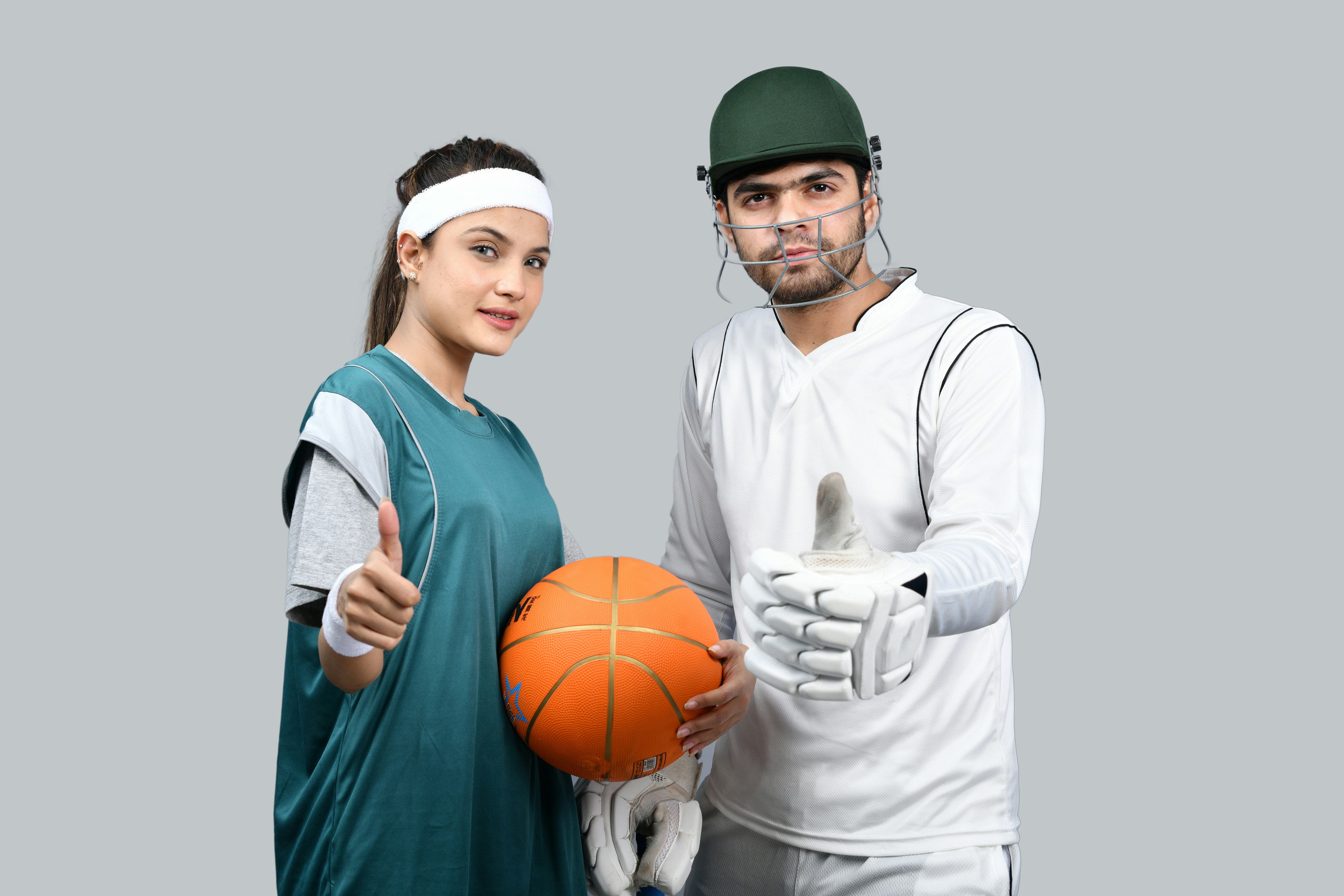 Two athletes in cricket and basketball gear